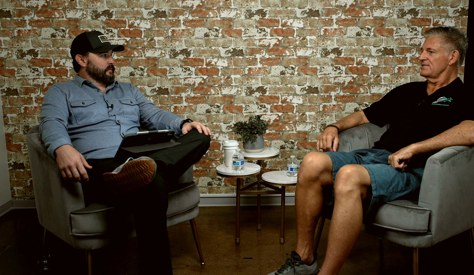 Richard Vietor and Paul Vespie seated across from each other in conversation.